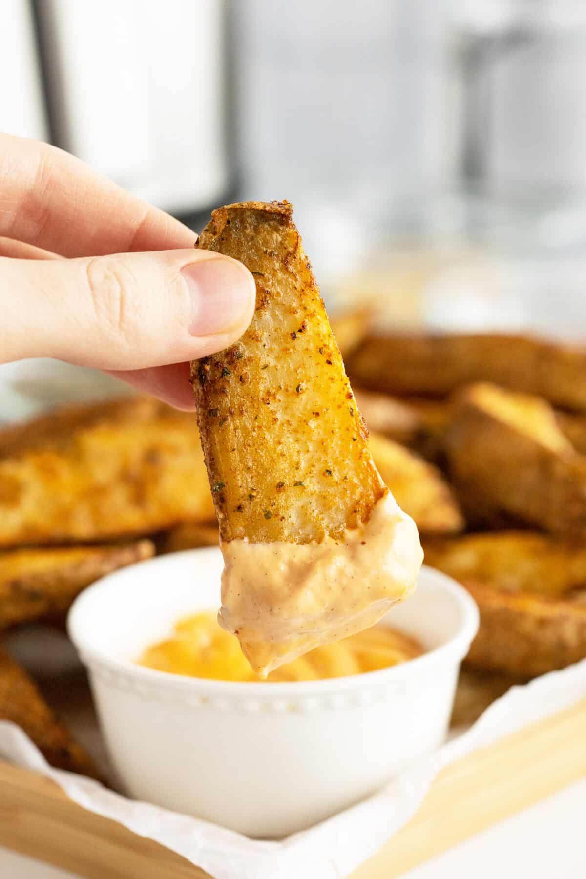 air fryer potato wedges dipped in sauce