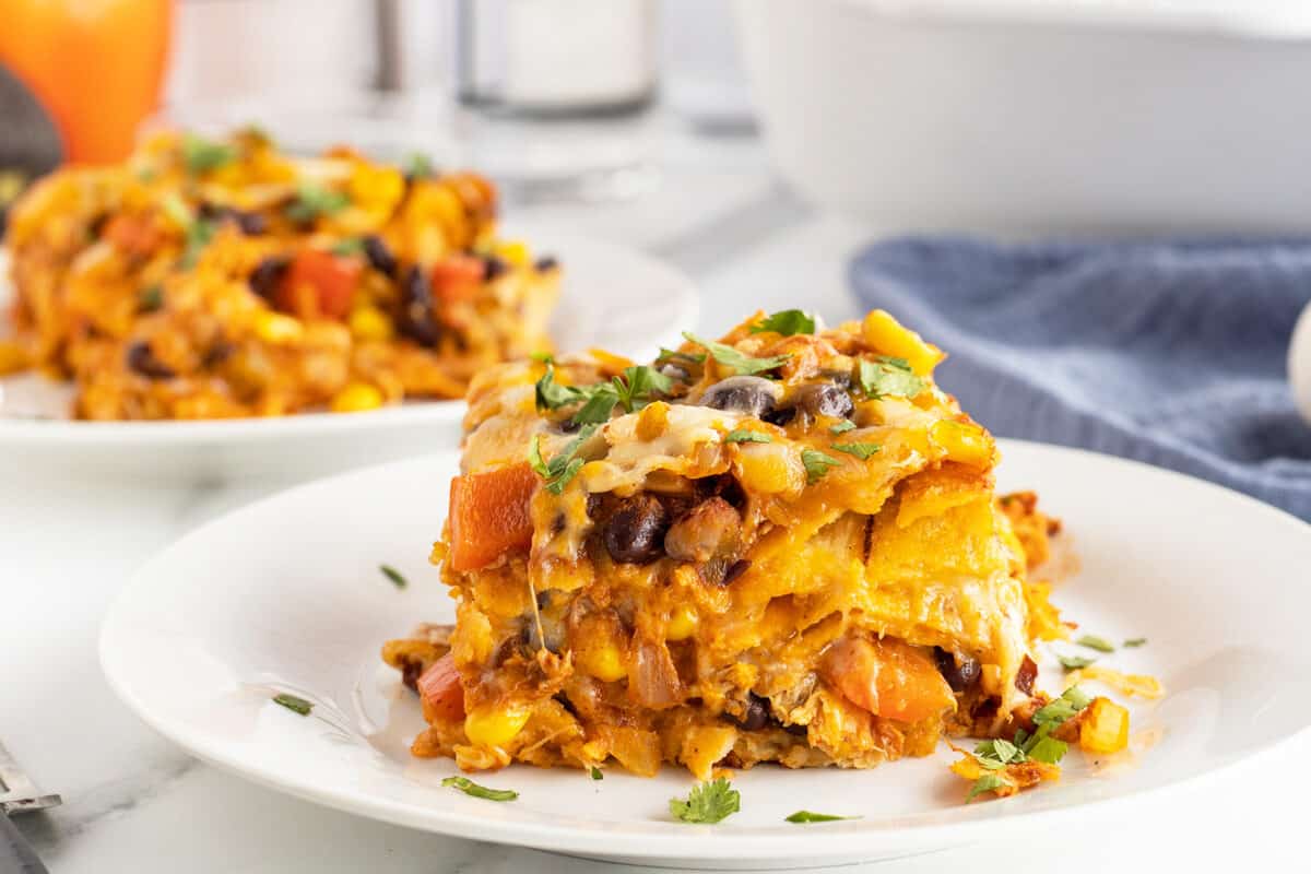 Chicken Enchilada Casserole slice on a white plate