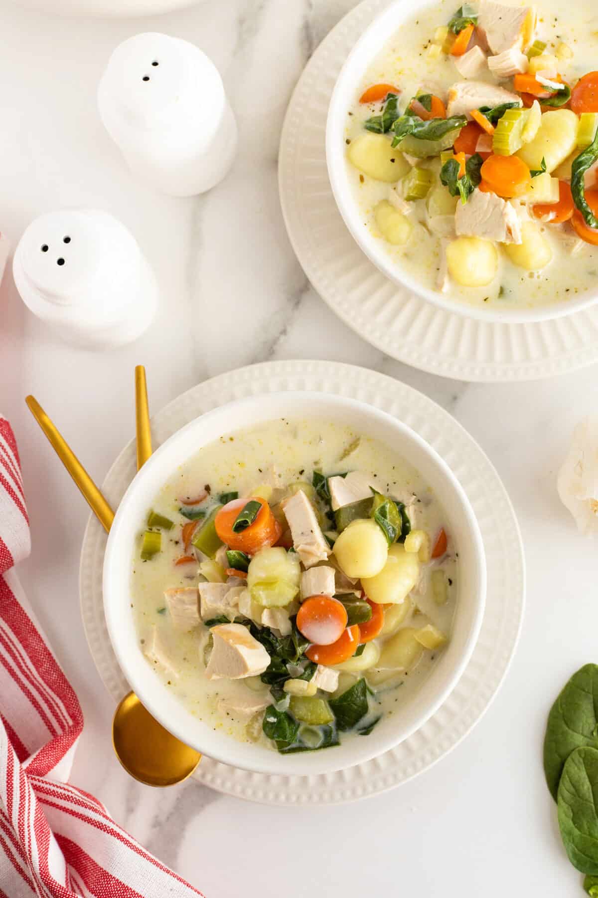 chicken gnocchi soup overhead view of two bowls full