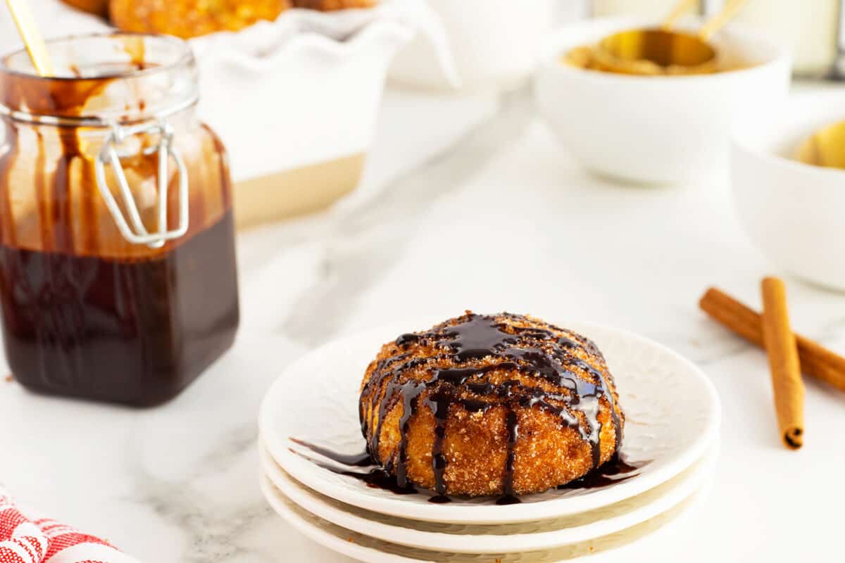 chocolate sauce drizzled on a doughnut