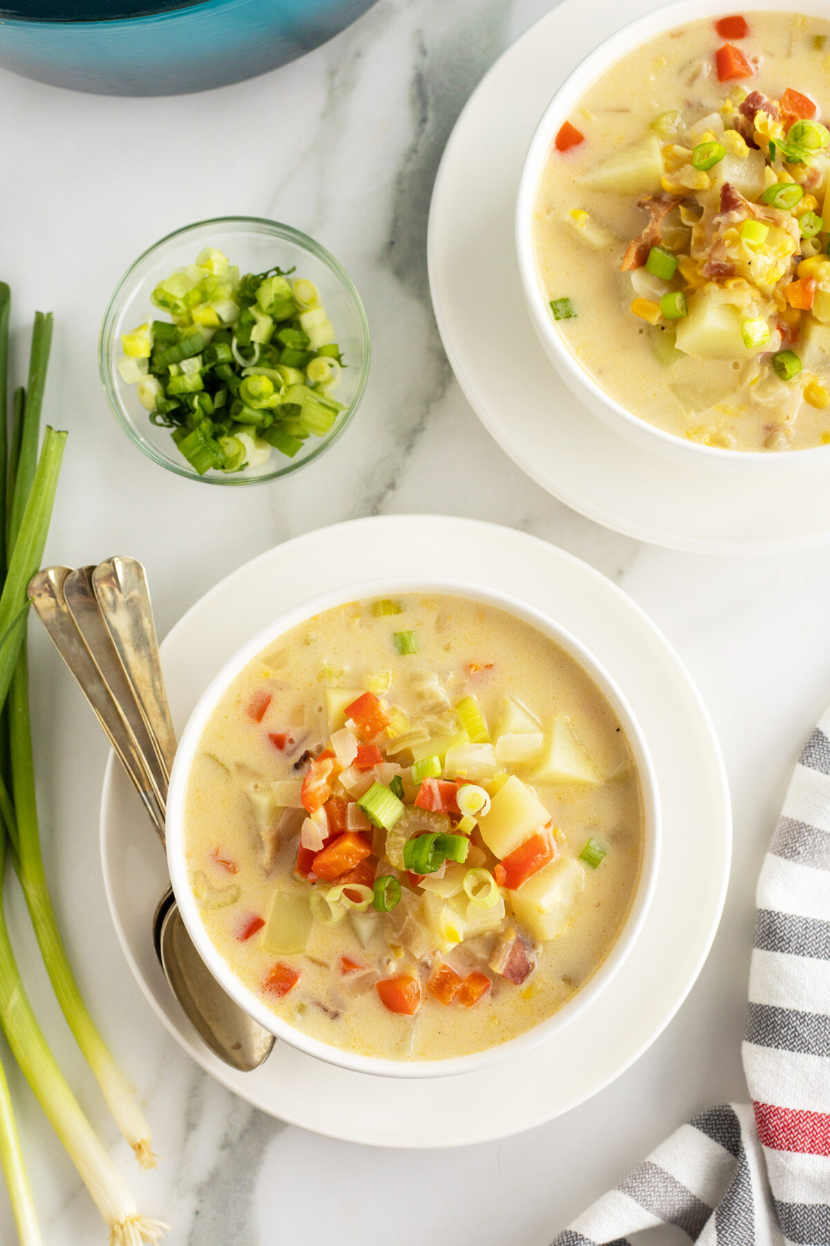 overhead view of two bowls of corn chowder