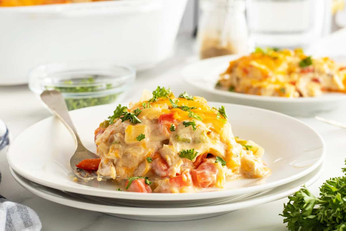 king ranch casserole on a white plate with a silver fork