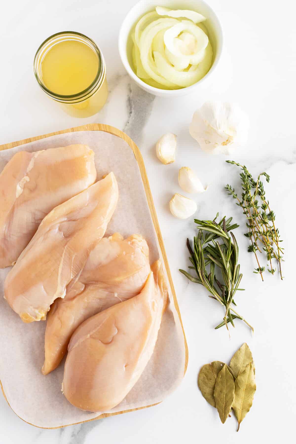 poached chicken ingredients on a cutting board