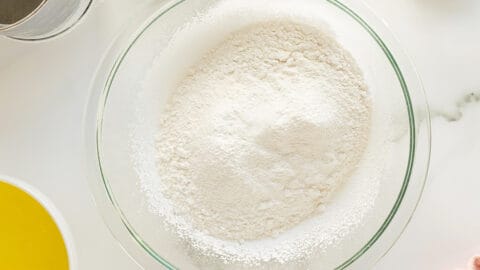 Angel cake dry ingredients in a clear mixing bowl