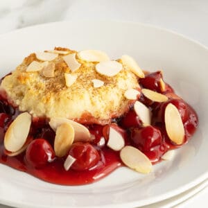 cherry cobbler on a white plate