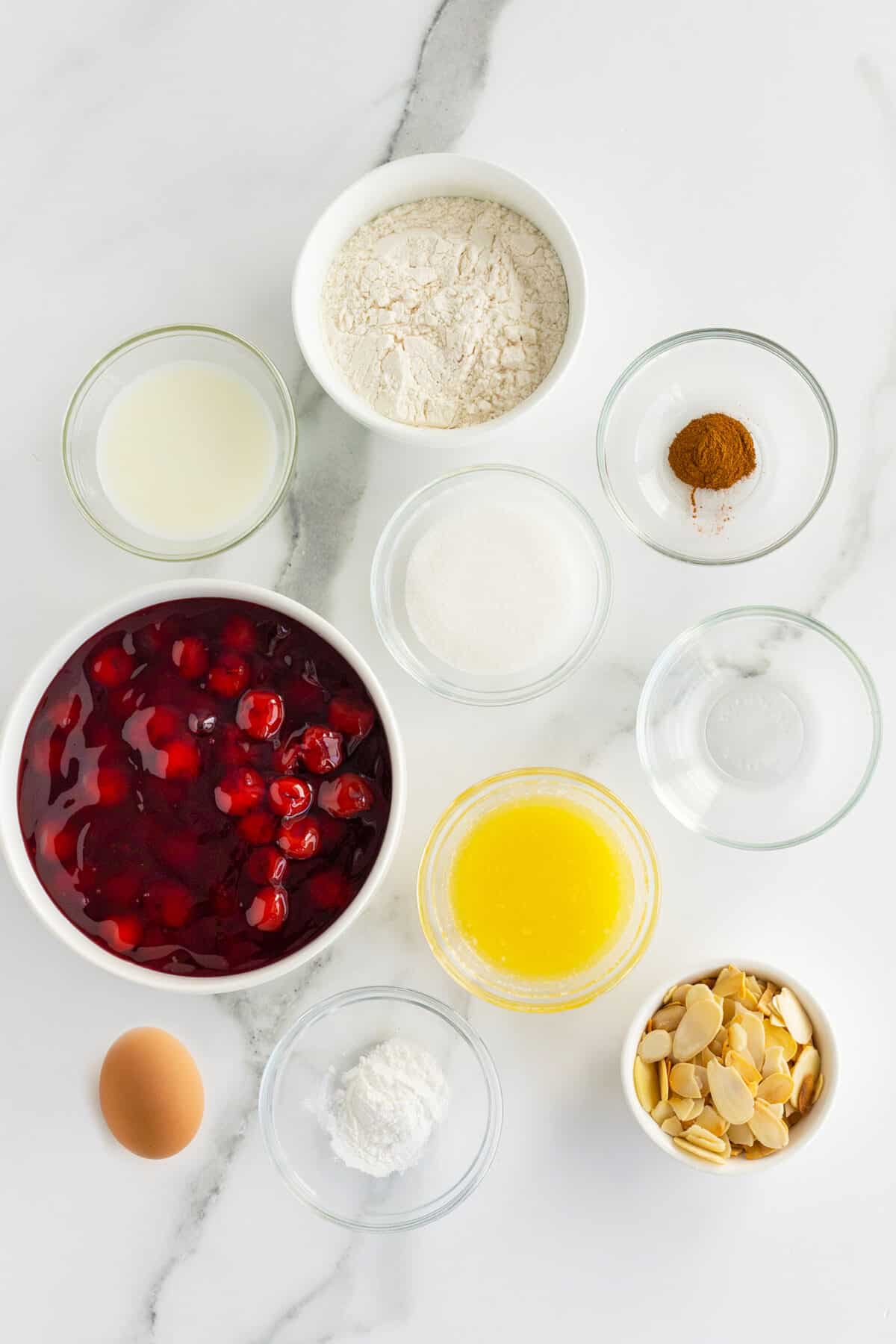 cherry cobbler ingredients in small white bowls
