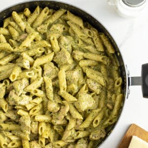 creamy chicken pesto pasta in a large pan