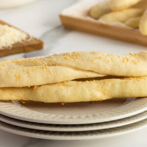 homemade breadsticks on a white plate