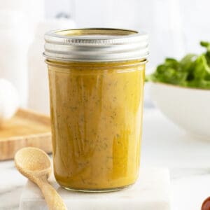 honey mustard dressing in a mason jar with a lid