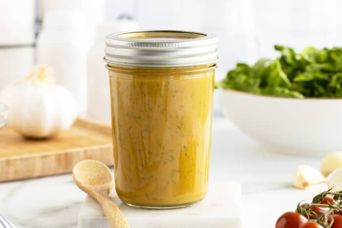 honey mustard dressing in a mason jar with a lid