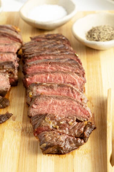 teriyaki steak sliced on a cutting board