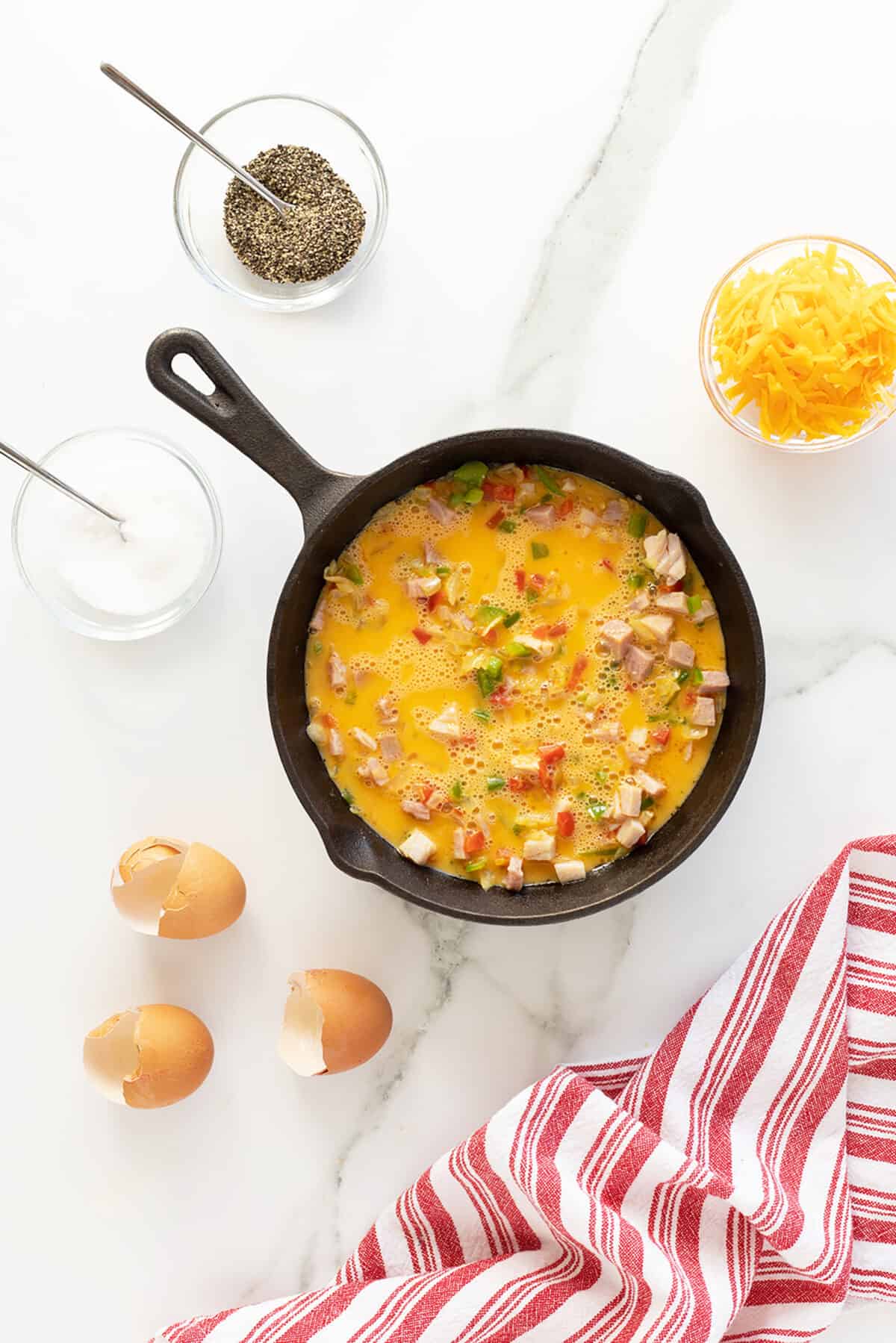 Denver omelet in a pan cooking 