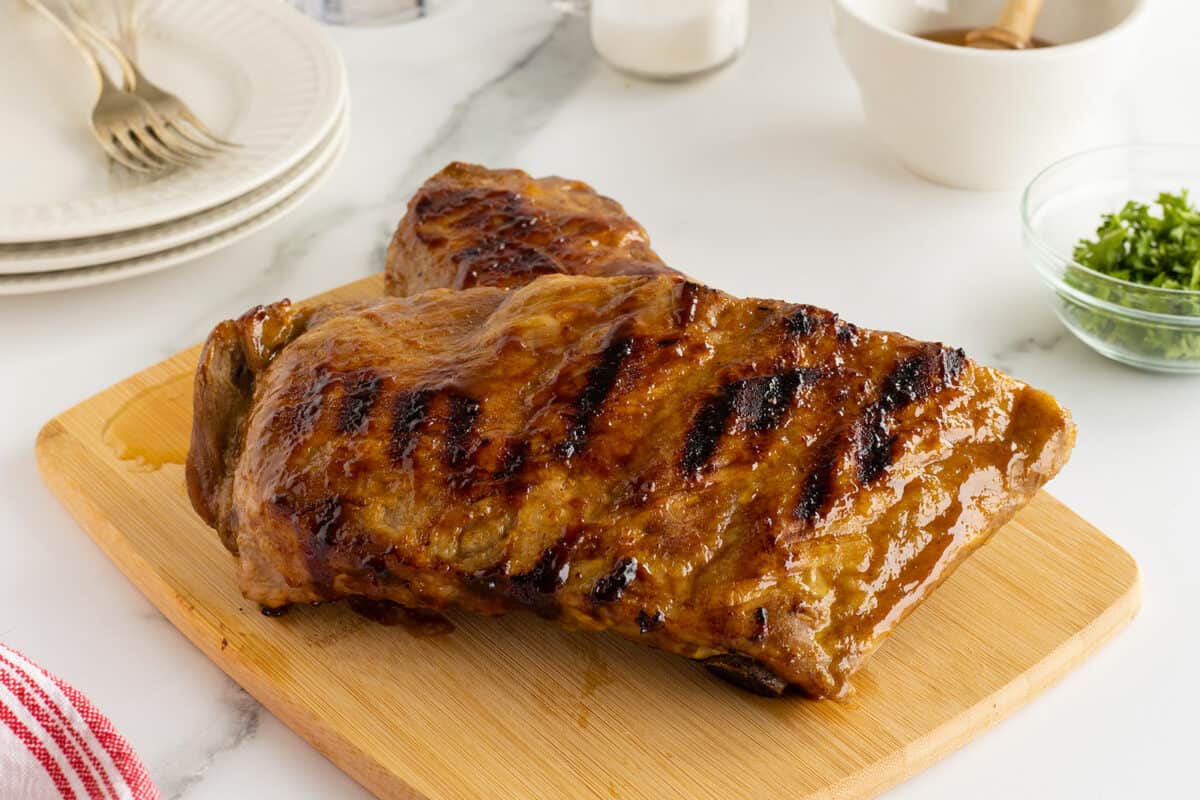 honey mustard glazed ribs whole on a cutting board