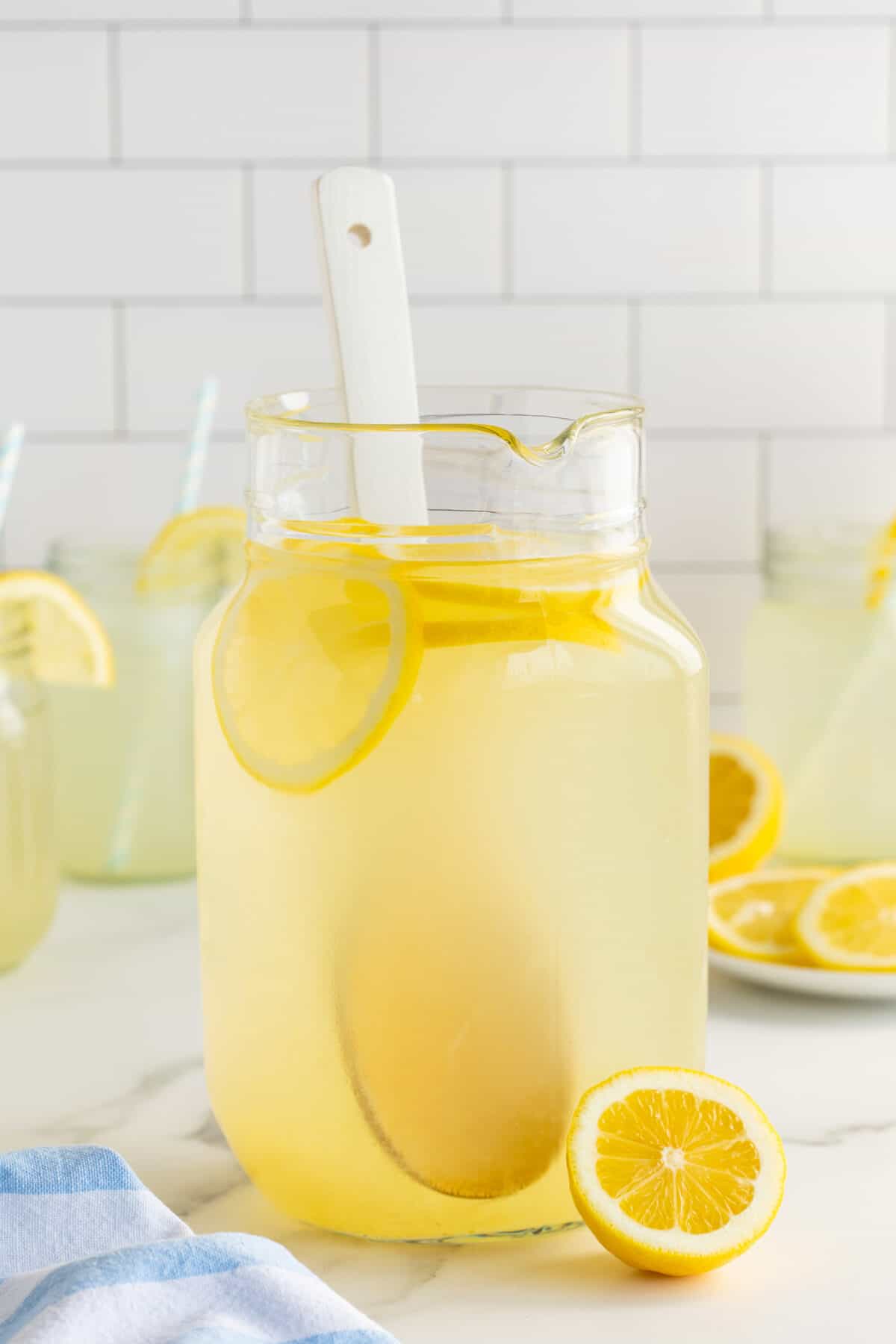 clear jug of fresh lemonade