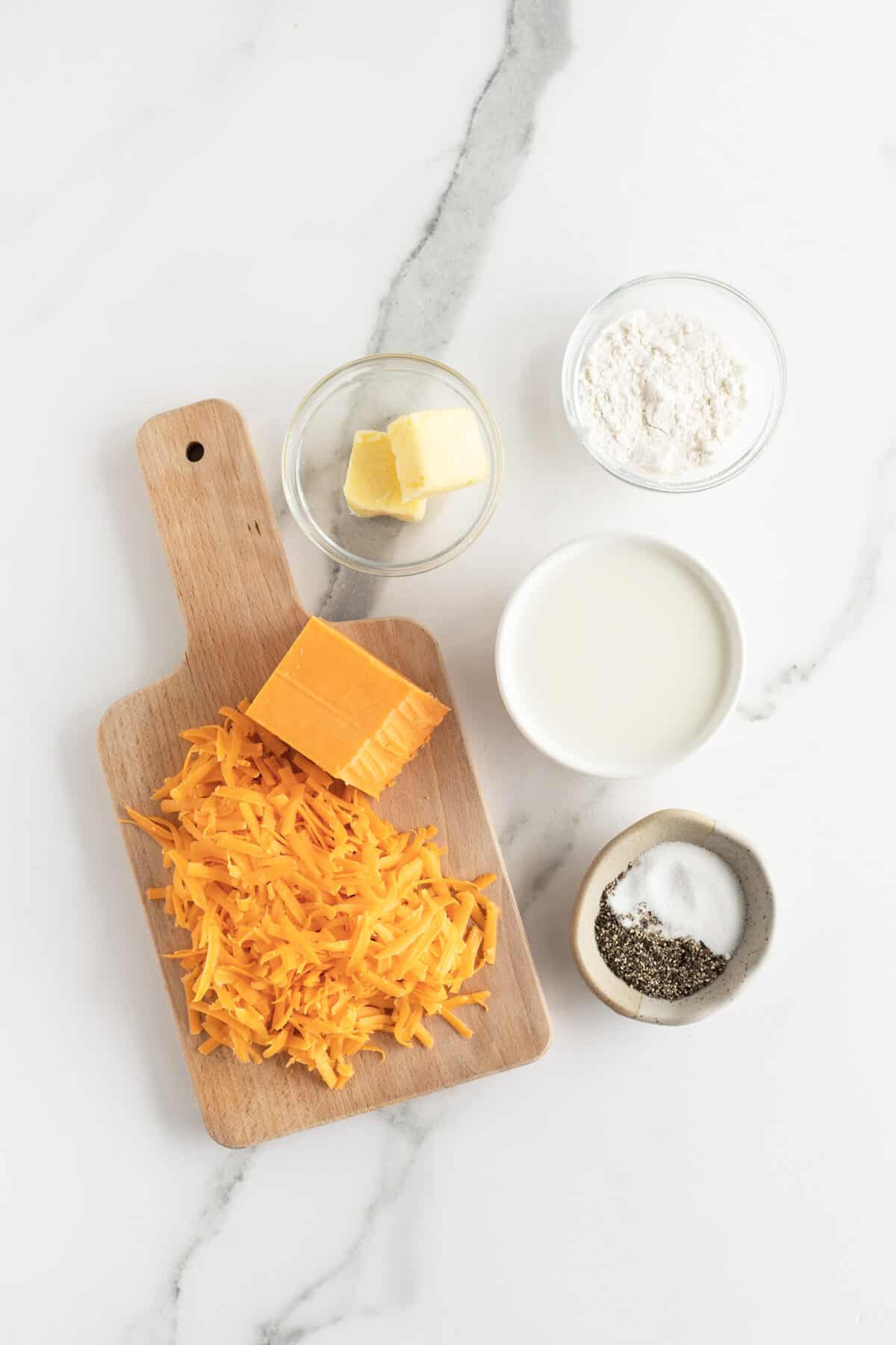 cheese sauce ingredients in small white cups