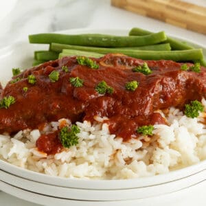 slow cooker short ribs on a plate with rice and green beans