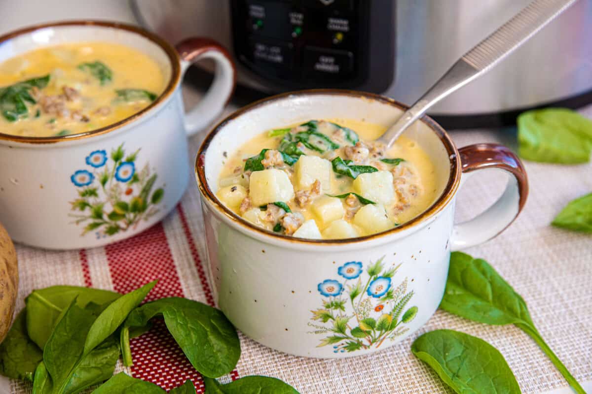 spinach and Italian sausage soup in a bowl 