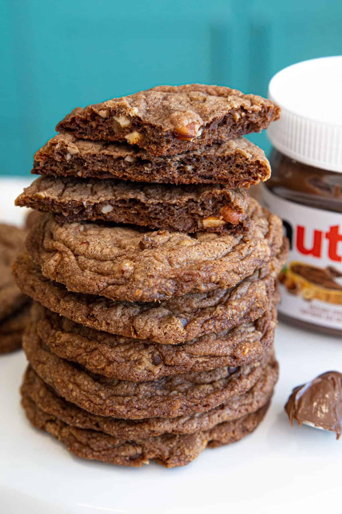 stack of Nutella cookies with a jar of Nutella