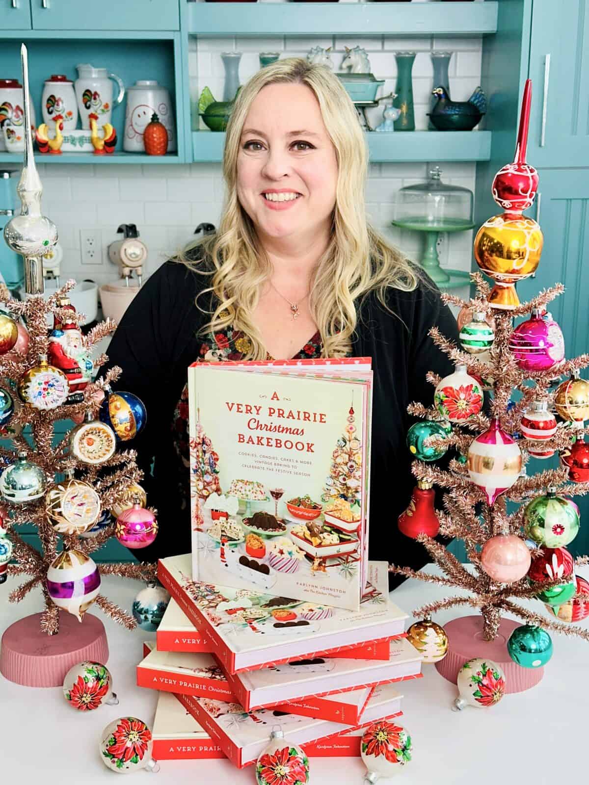 Karlynn Johnston with her bestselling cookbook A Very Prairie Christmas Bakebook