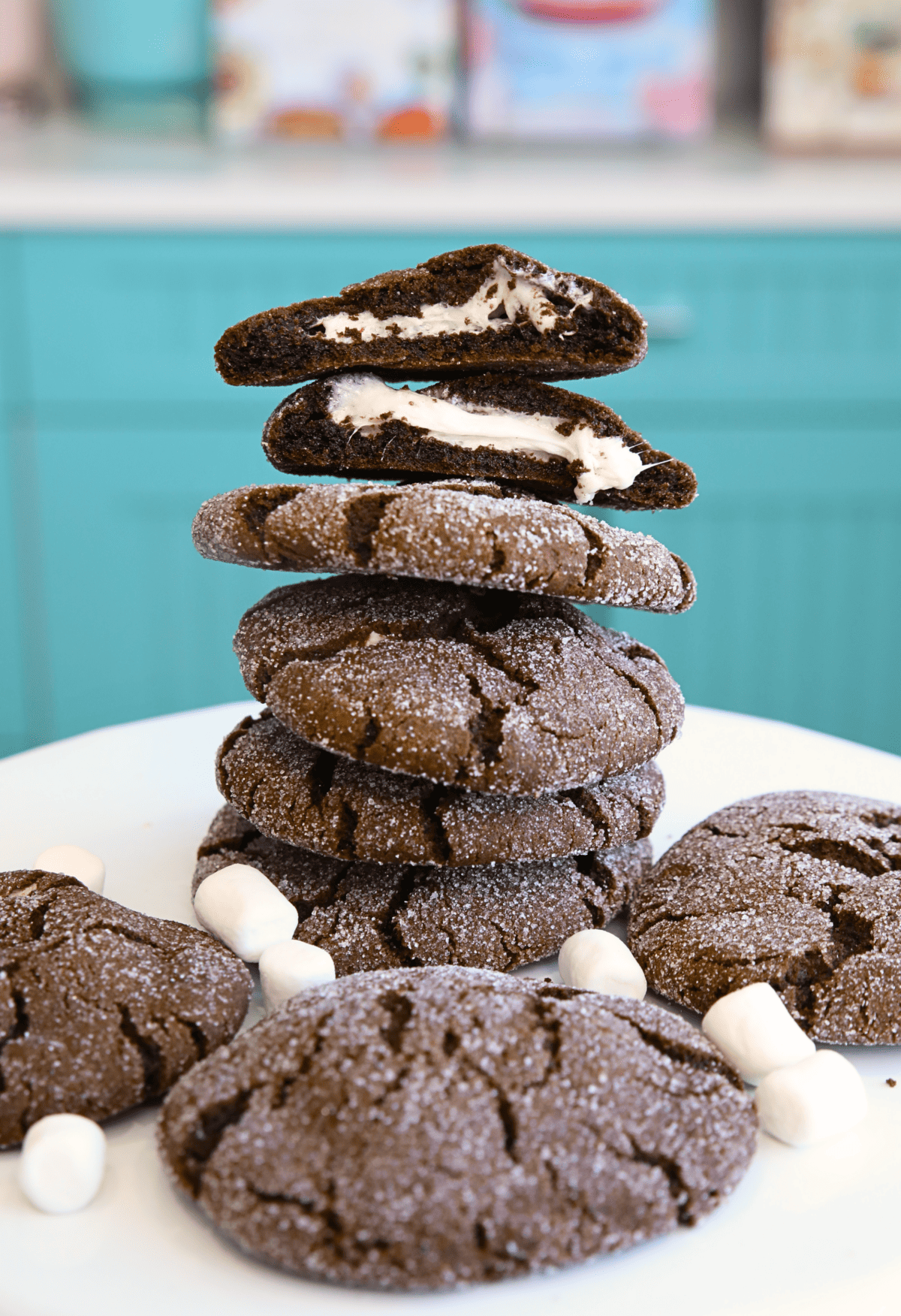 Marshmallow Cookies in a stack with one cookie sliced in half showing the marshmallow filling 
