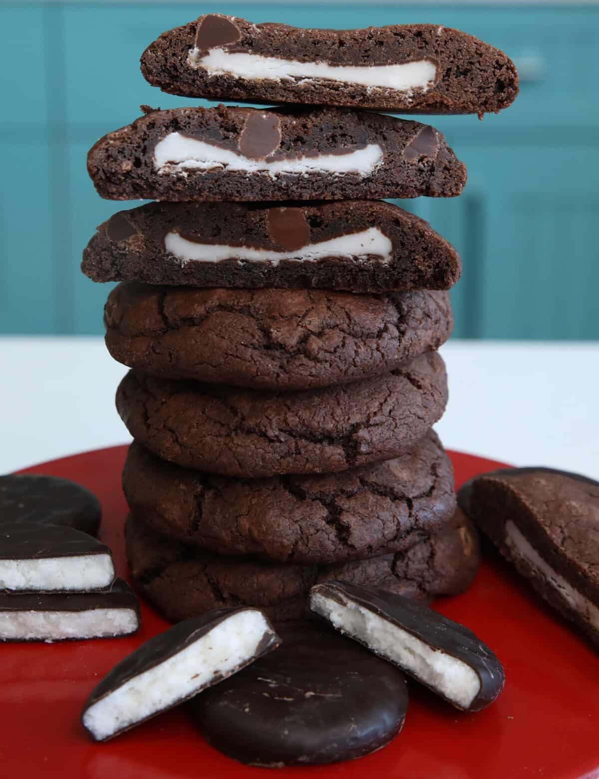stacked double mint stuffed chocolate chip cookies top cookie cut in half showing mint filling