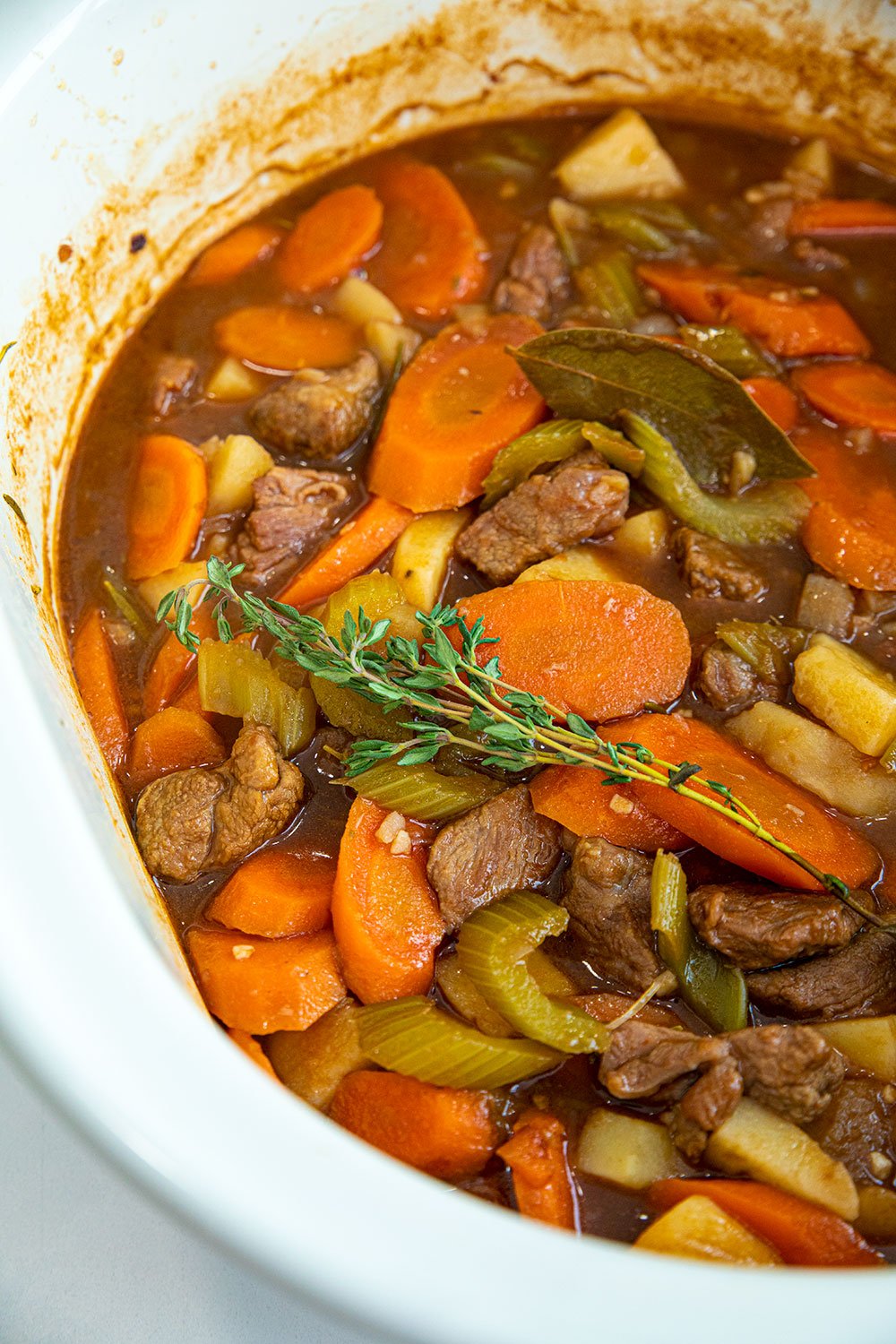 fresh thyme garnishing lamb stew