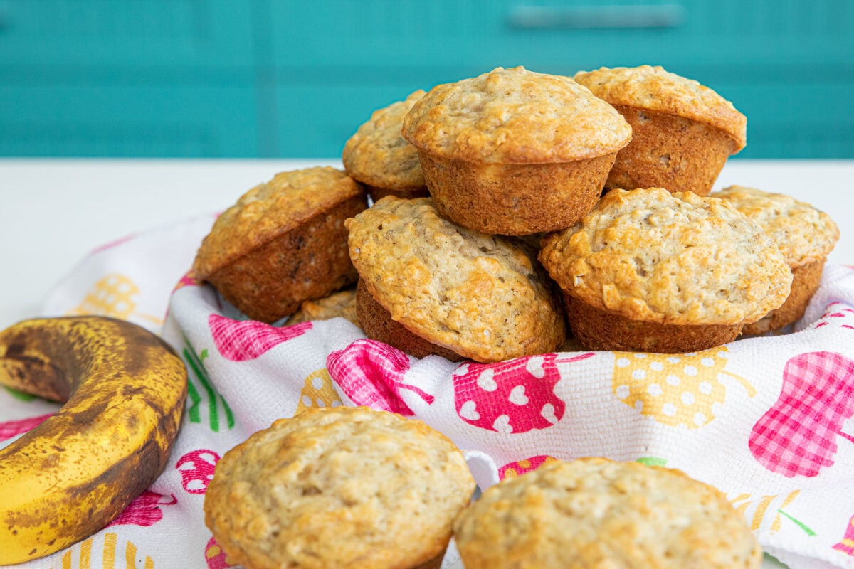 a basket full of banana oatmeal muffins