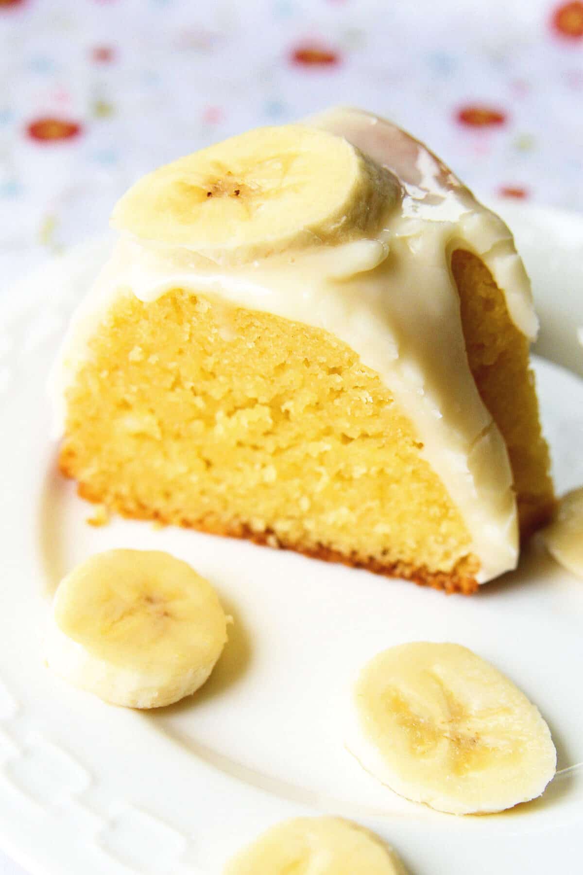 a slice of banana cake on a white plate