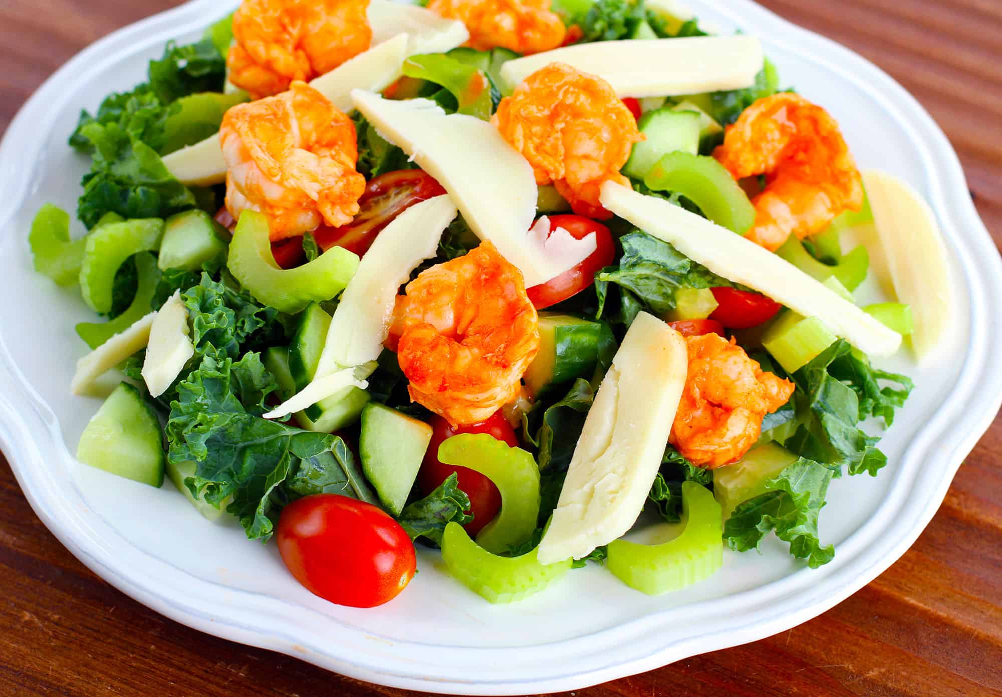 Spicy shrimp over fresh kale with creamy dressing.