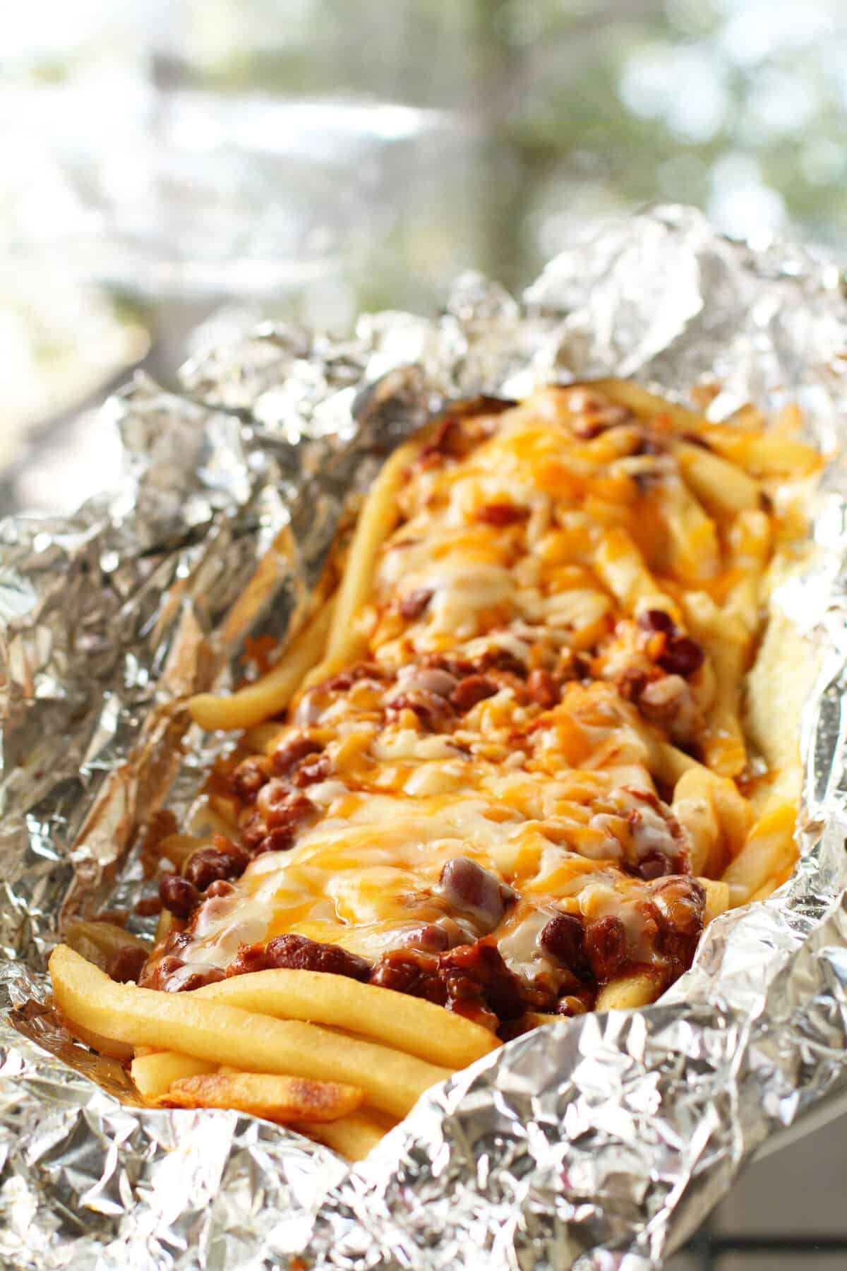 chili cheese fries in an aluminum foil packet