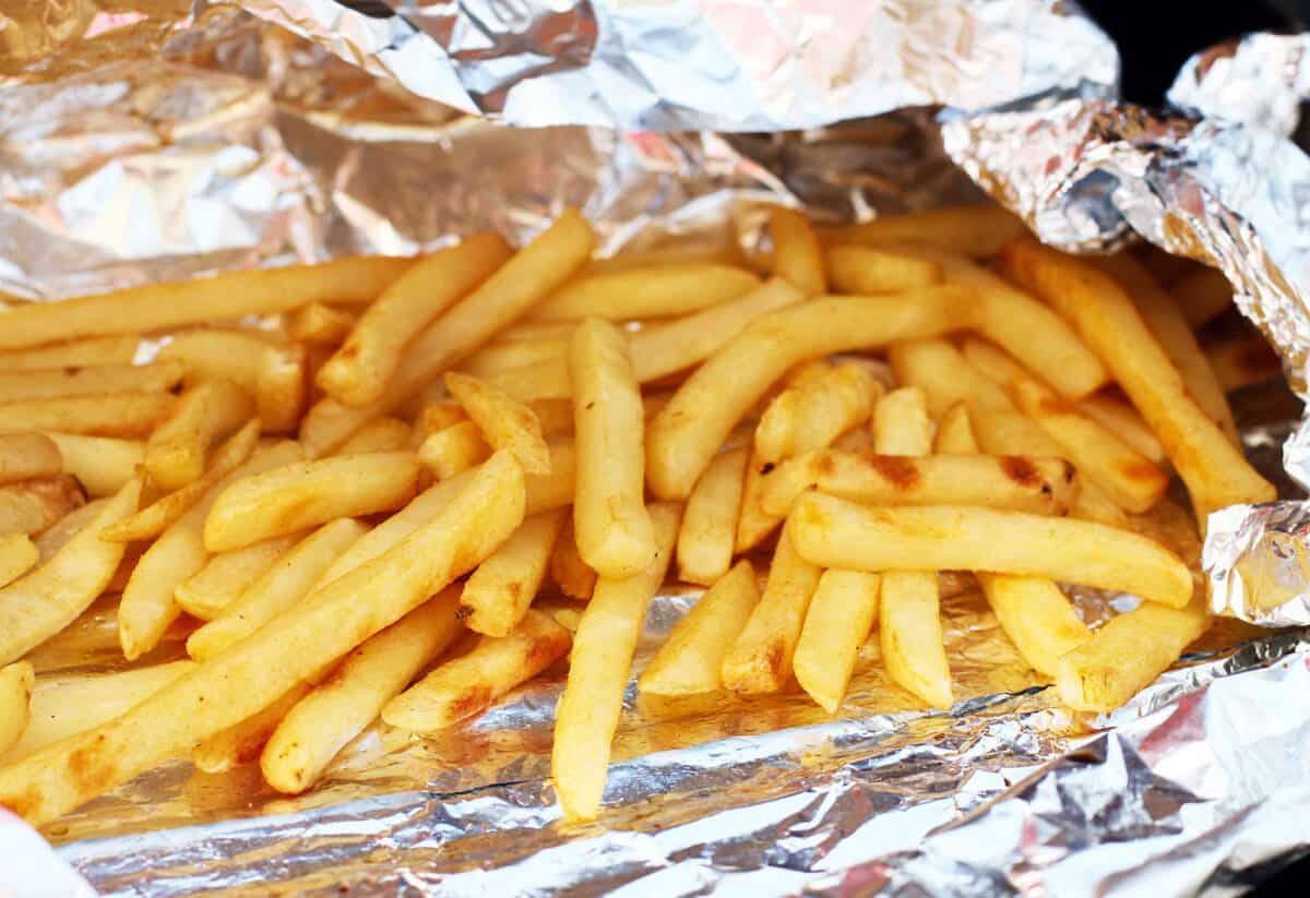 crispy French fries baked in aluminum foil