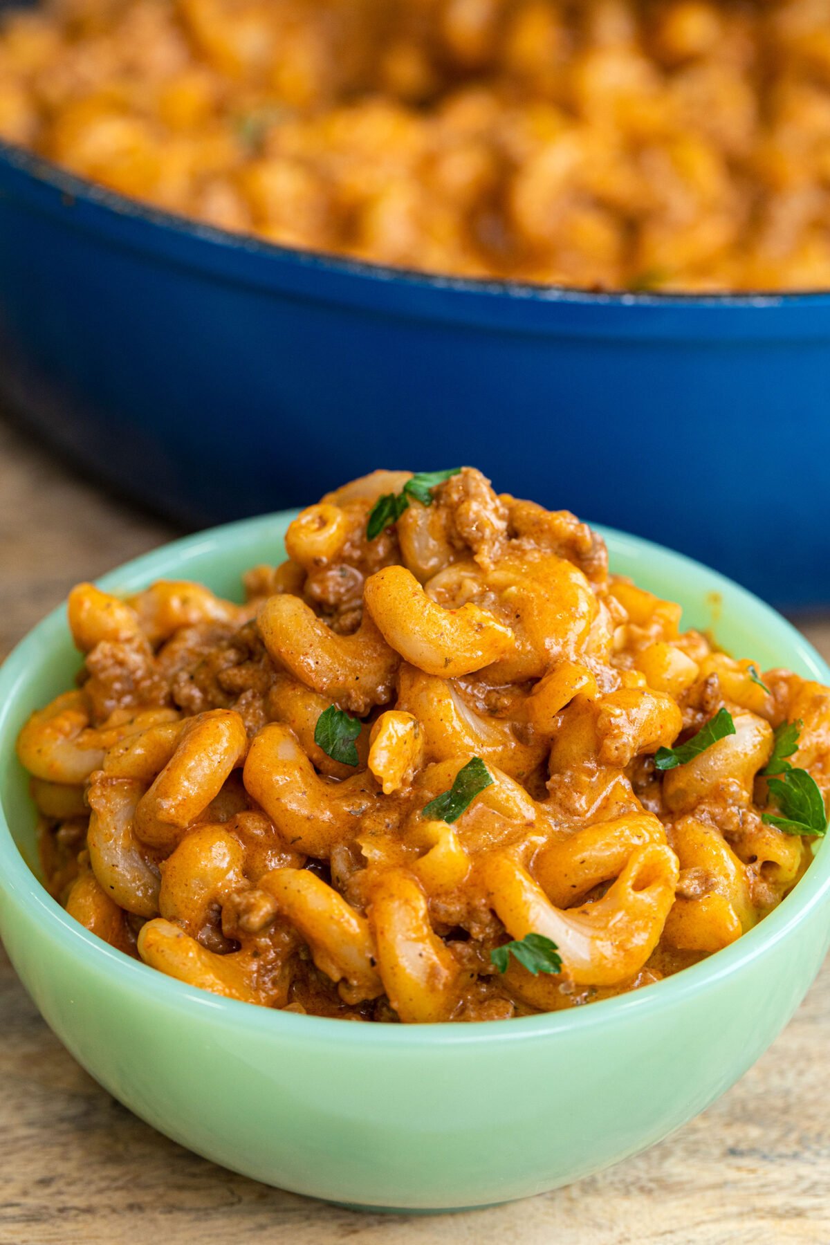 a serving of homemade hamburger helper in a green jadeite bowl