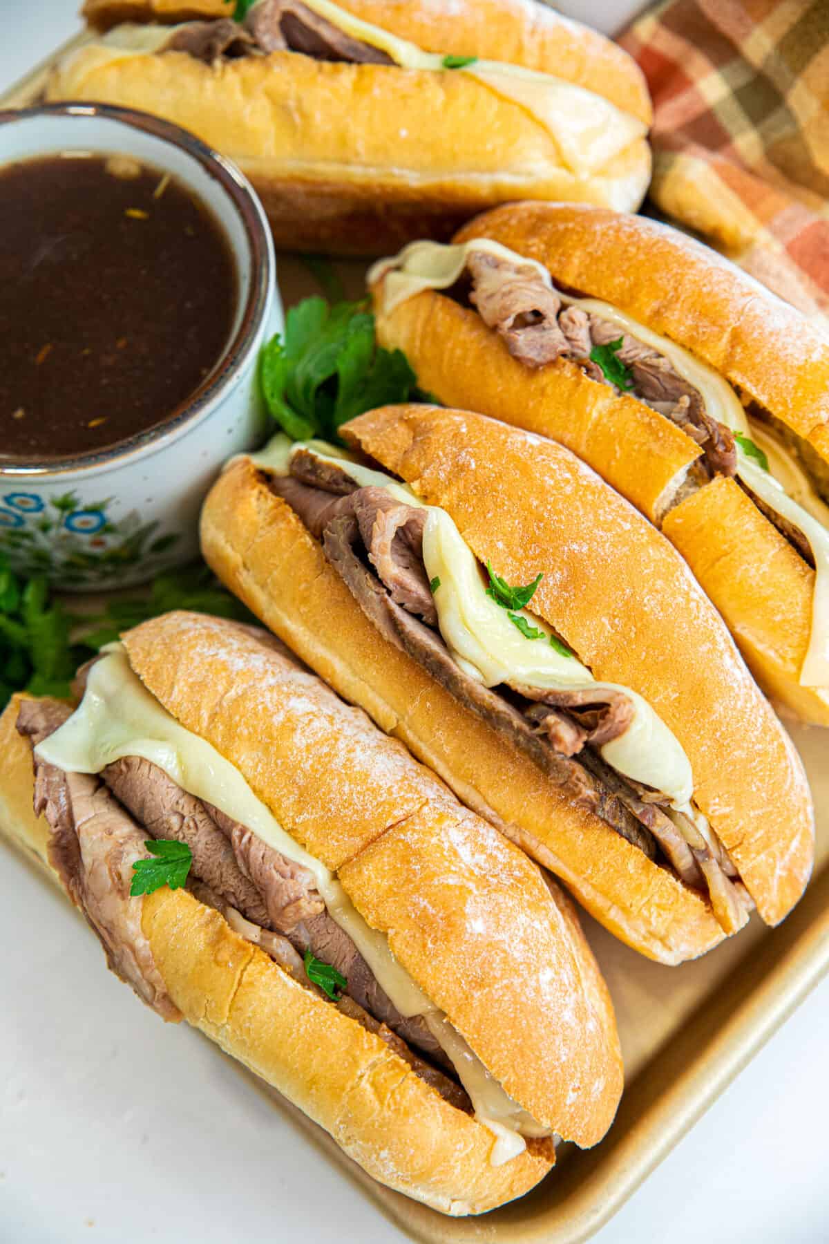 prime rib beef dips and a bowl of au jus