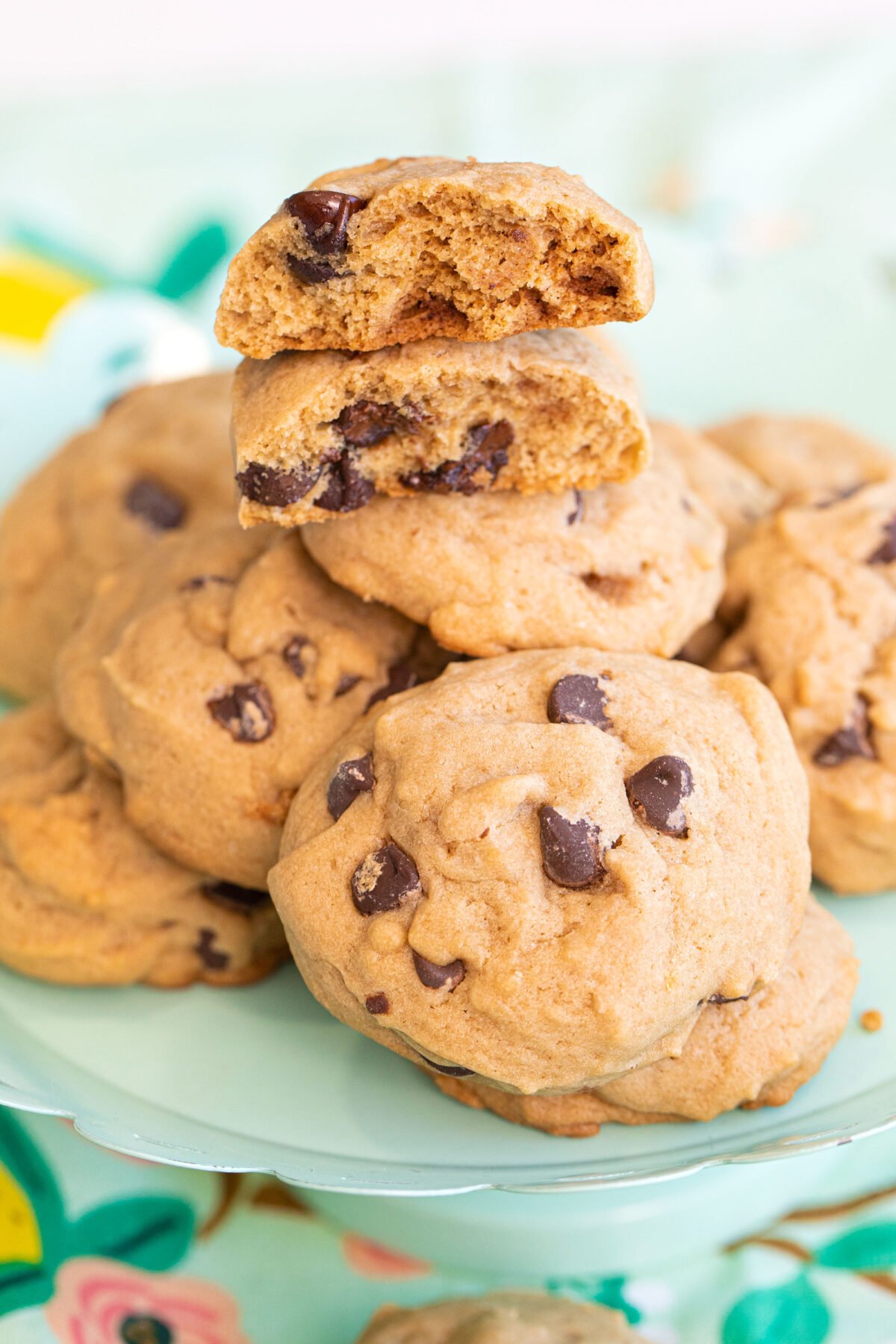 soft cakey chocolate chip cookies in a pile