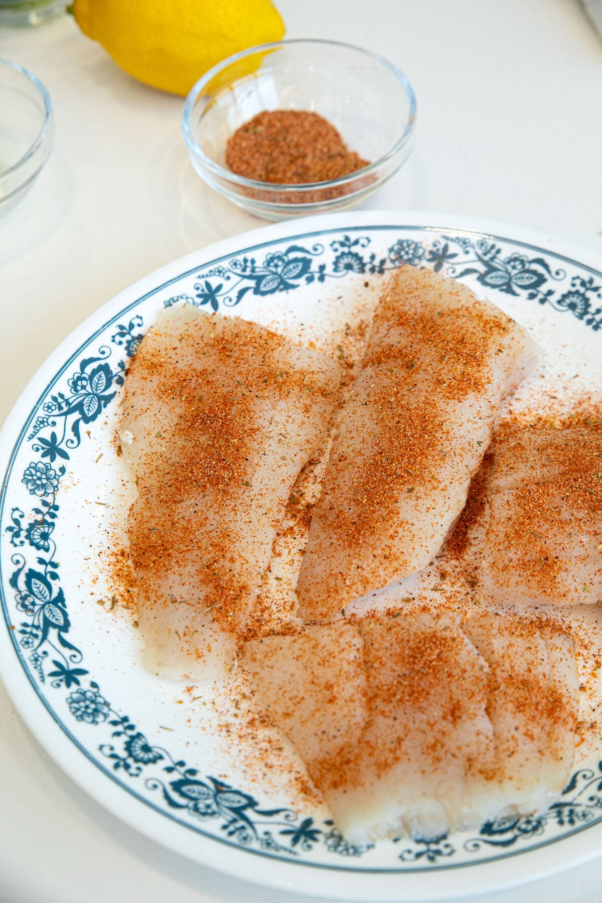 seasoning cod fillets with Cajun seasoning