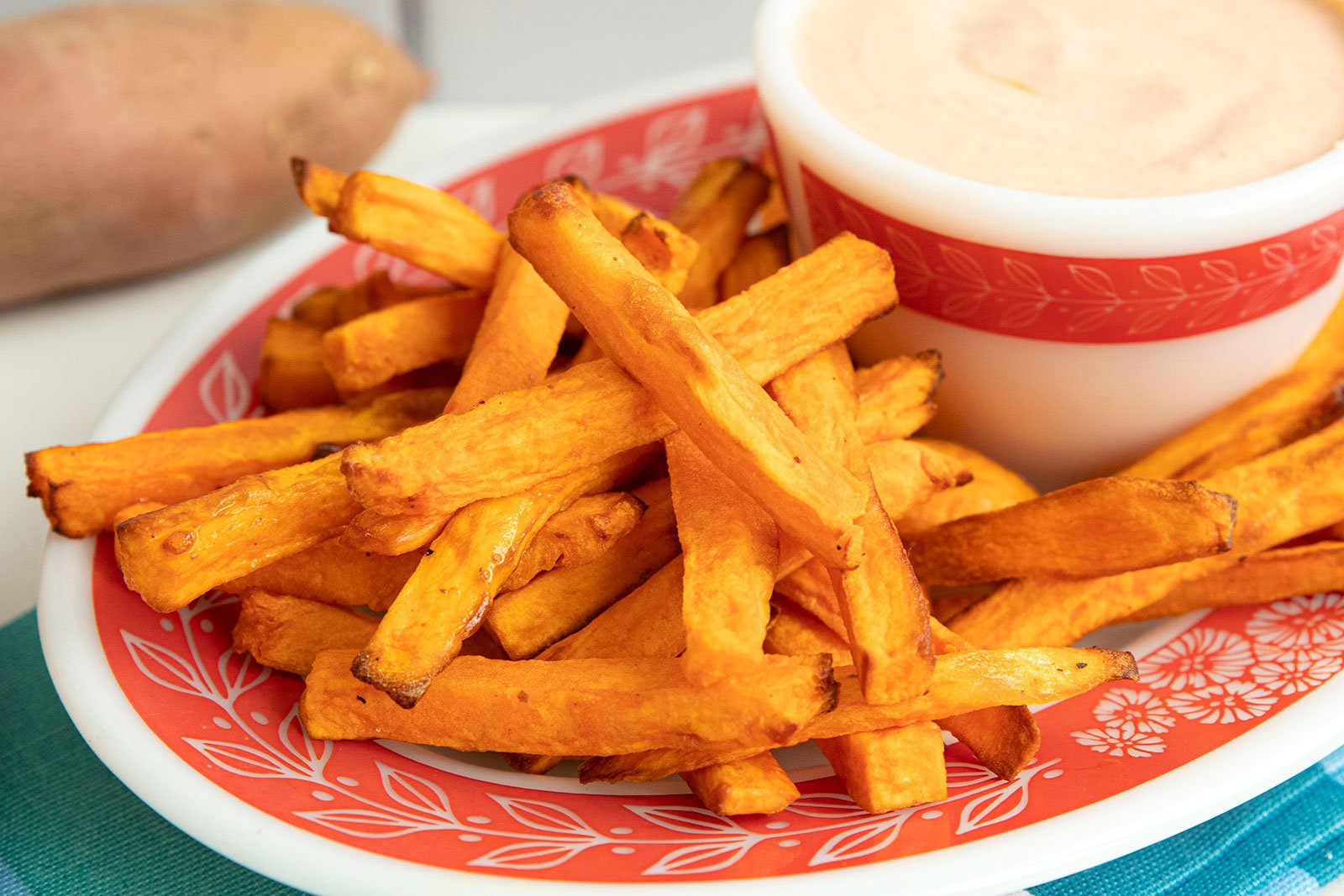 Crispy, golden sweet potato fries made healthier in the air fryer.