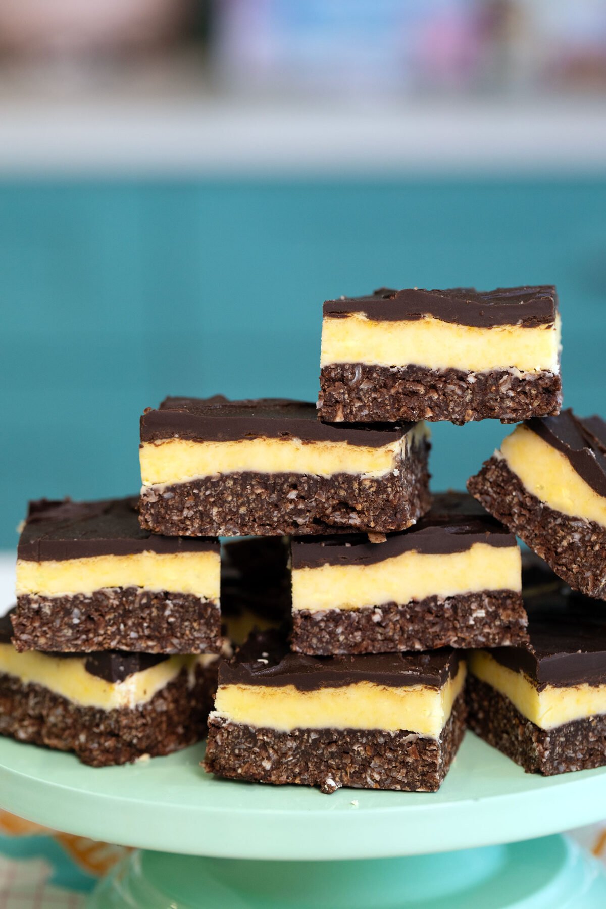a stack of Nanaimo bars on a plate