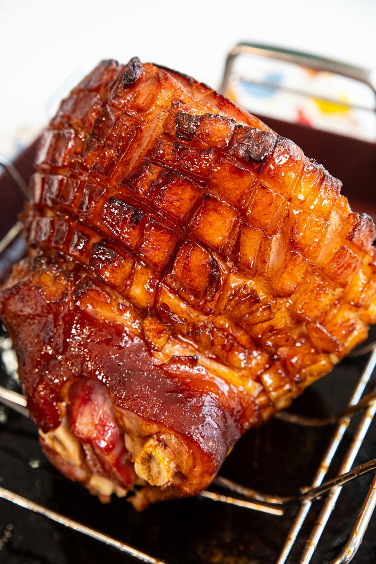 A baked ham topped with brown sugar glaze