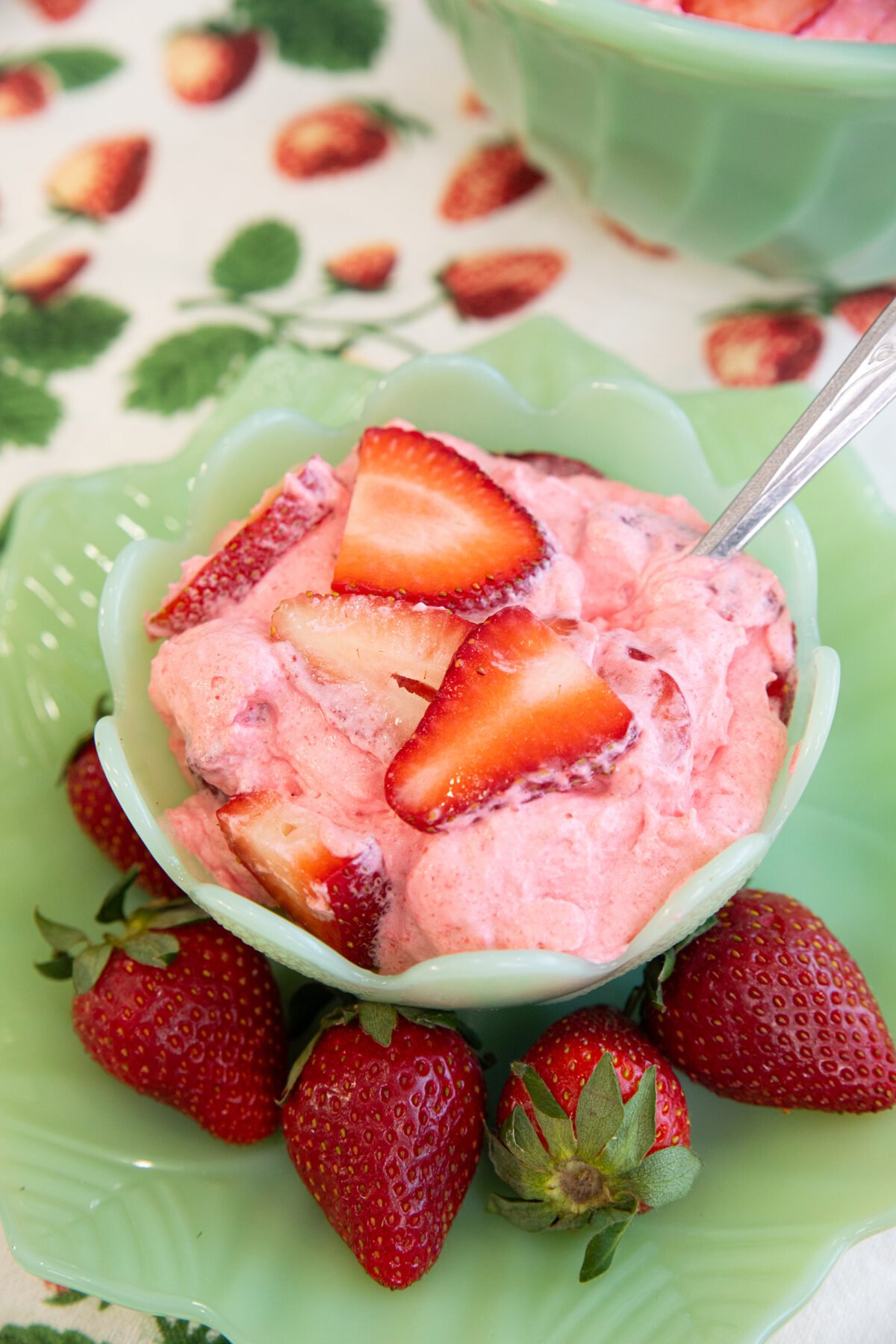a jadeite bowl of strawberry fluff
