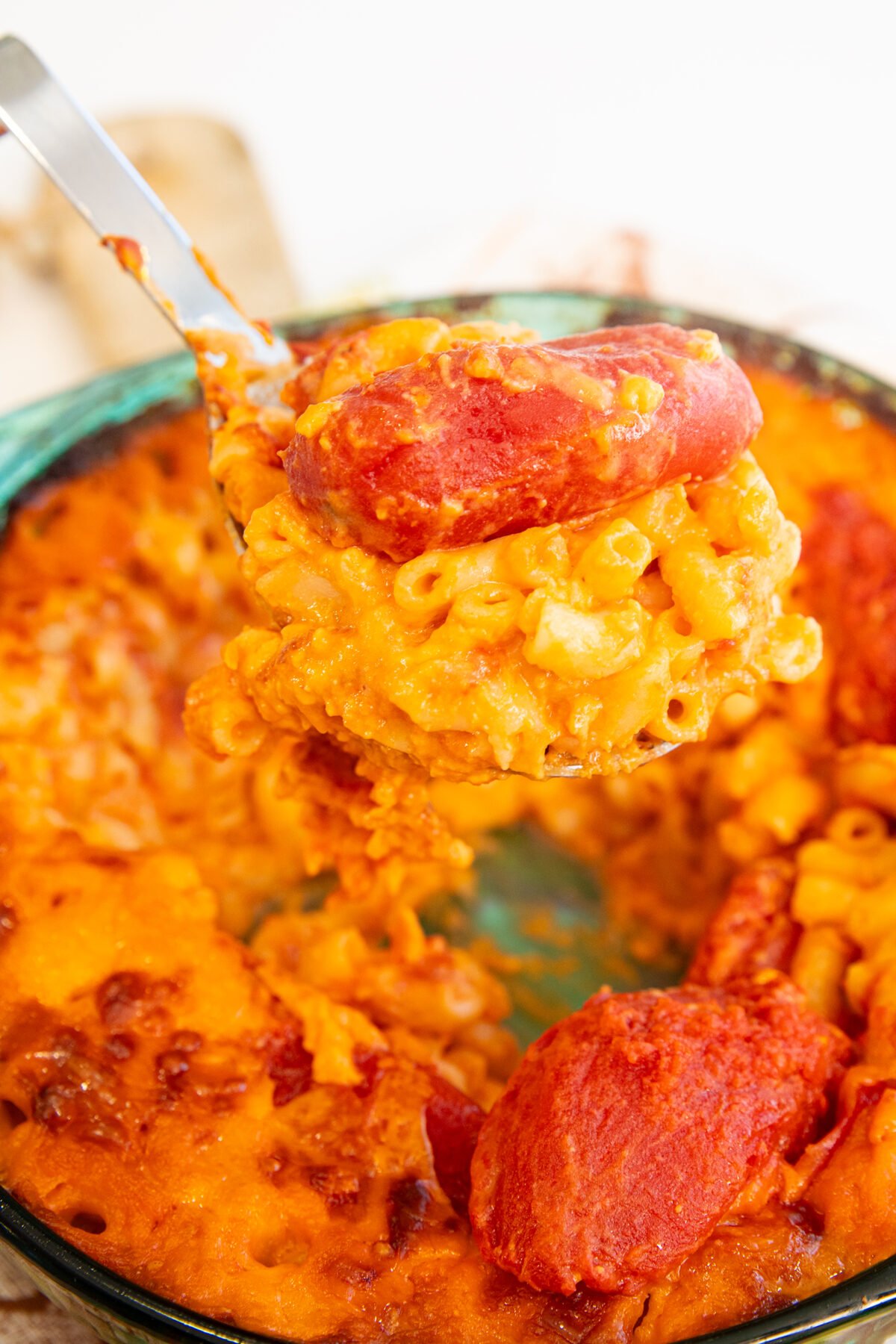 a spoon full of tomato mac and cheese