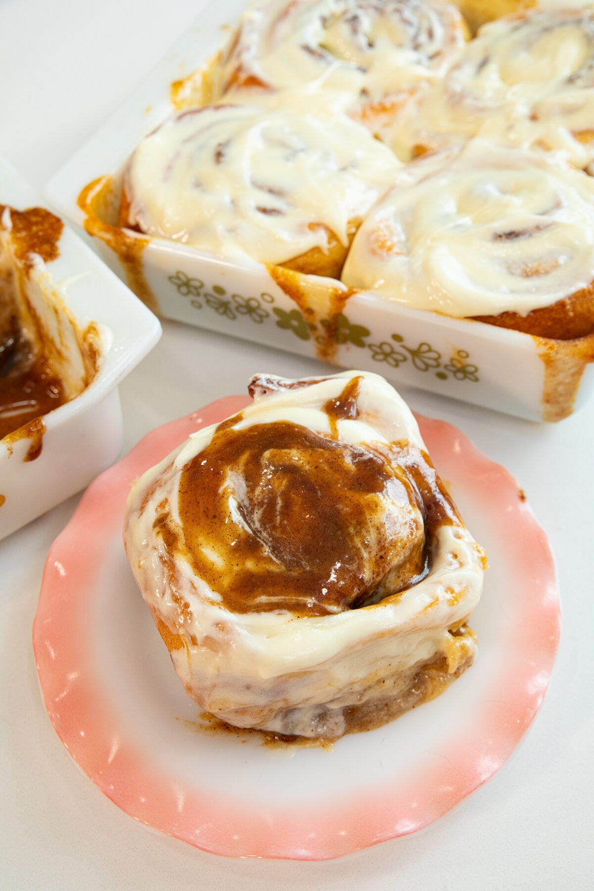 cinnamon roll on a pink plate