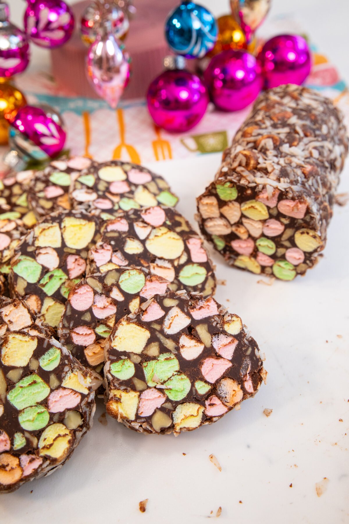 Marshmallow Yule Log sliced on a white board