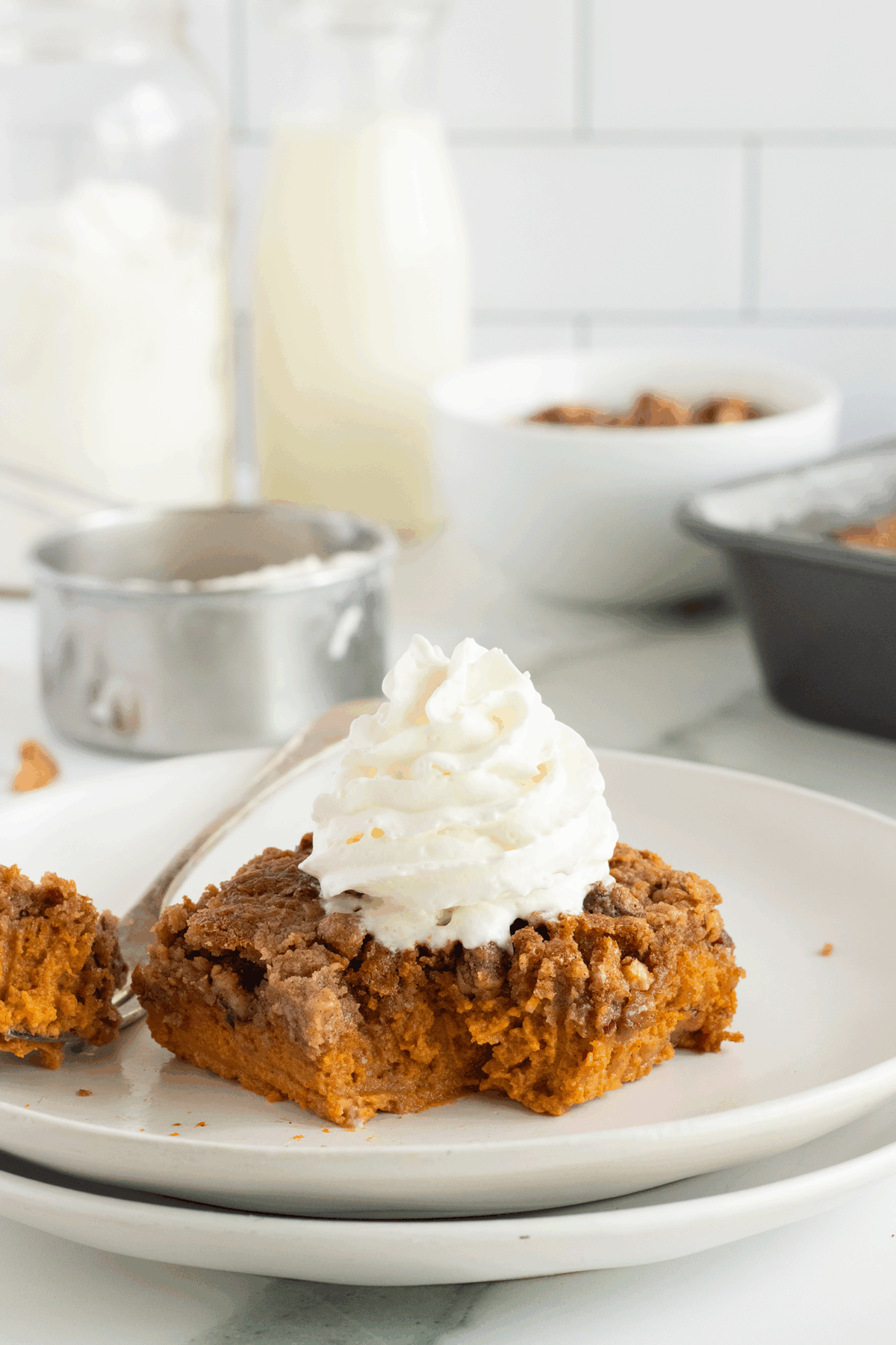 A plate of food with a fork and a spoon.