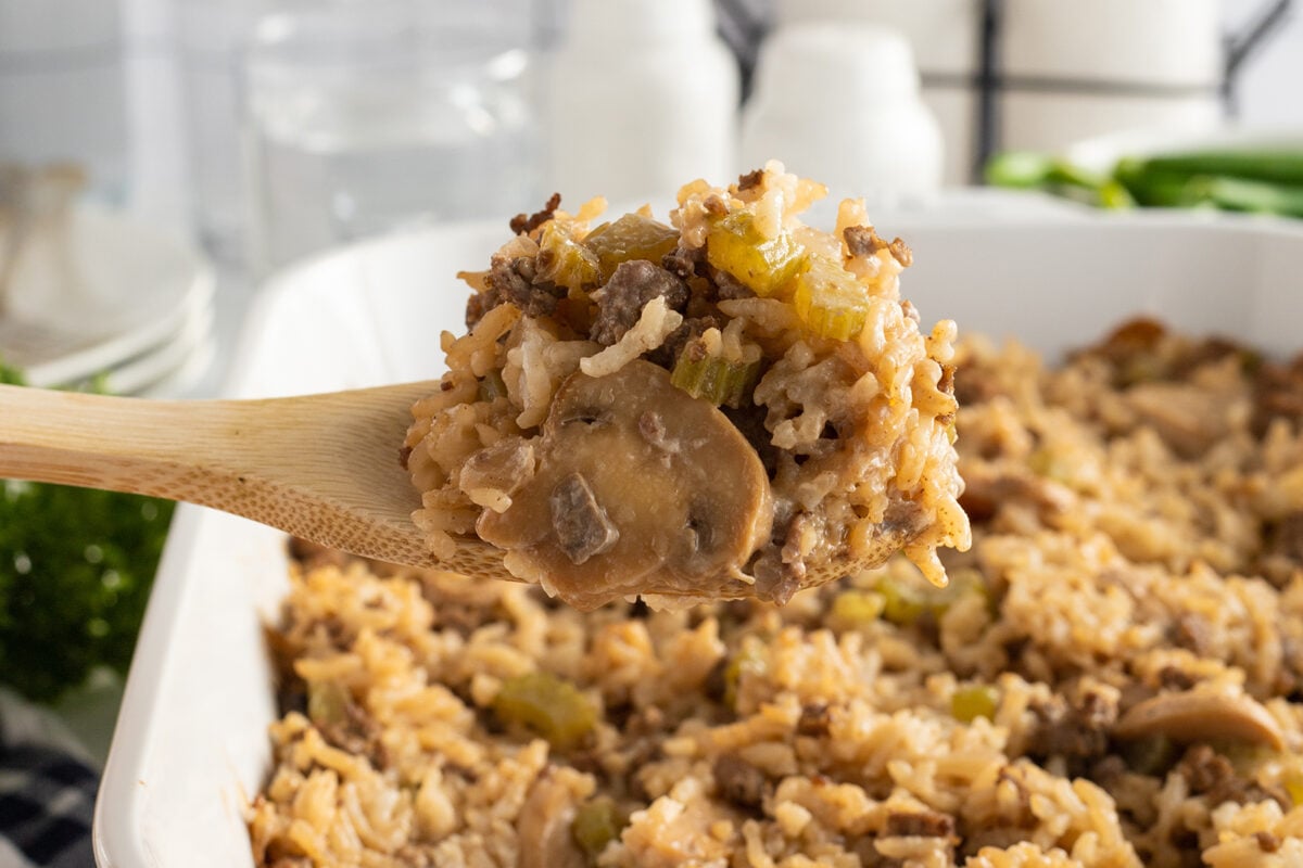 Halal ground beef mushroom rice casserole baked with broth and herbs for hearty comforting family dinner